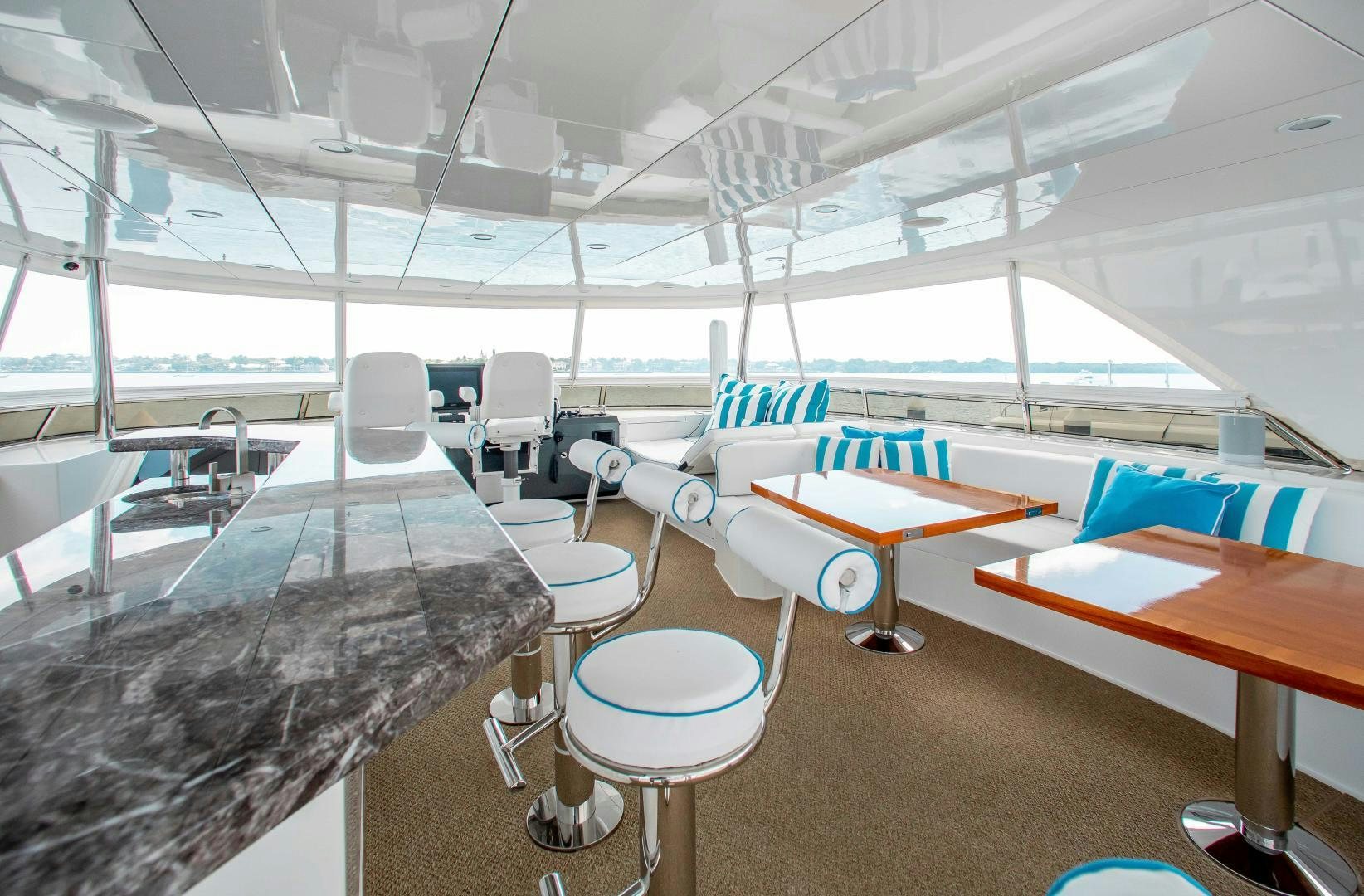 an empty room with chairs and tables aboard TRINITY Yacht for Sale