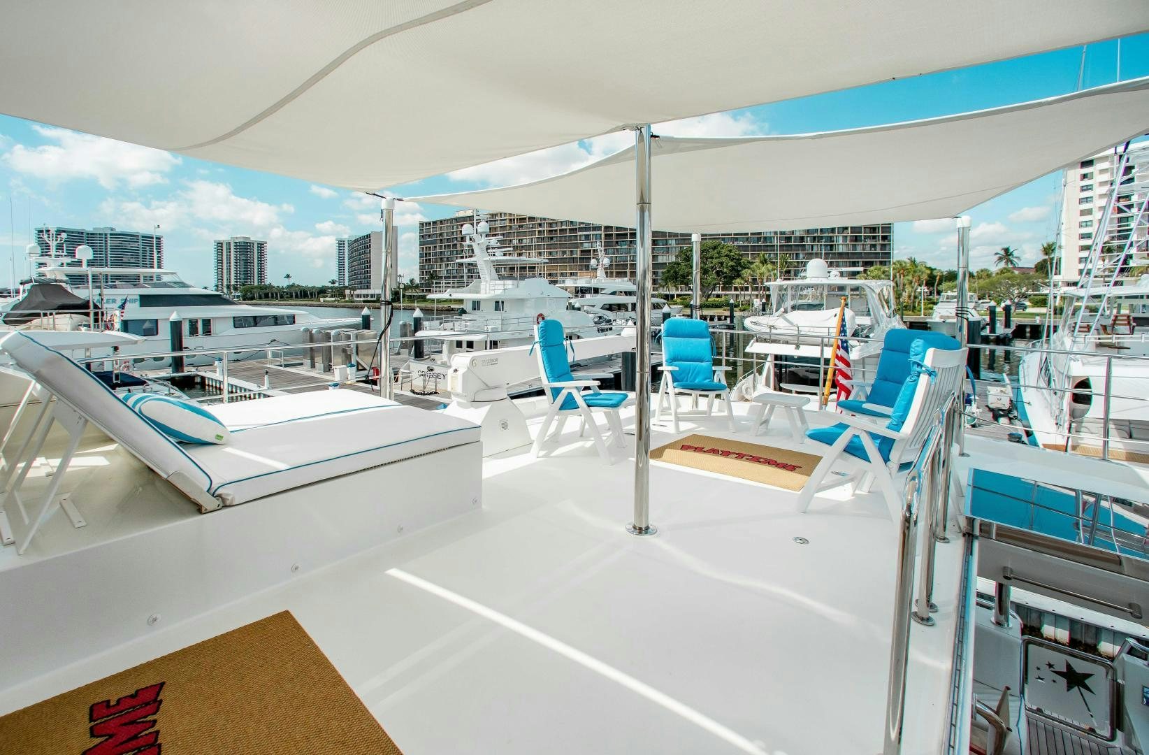 a room with a view of a city and a pool aboard TRINITY Yacht for Sale