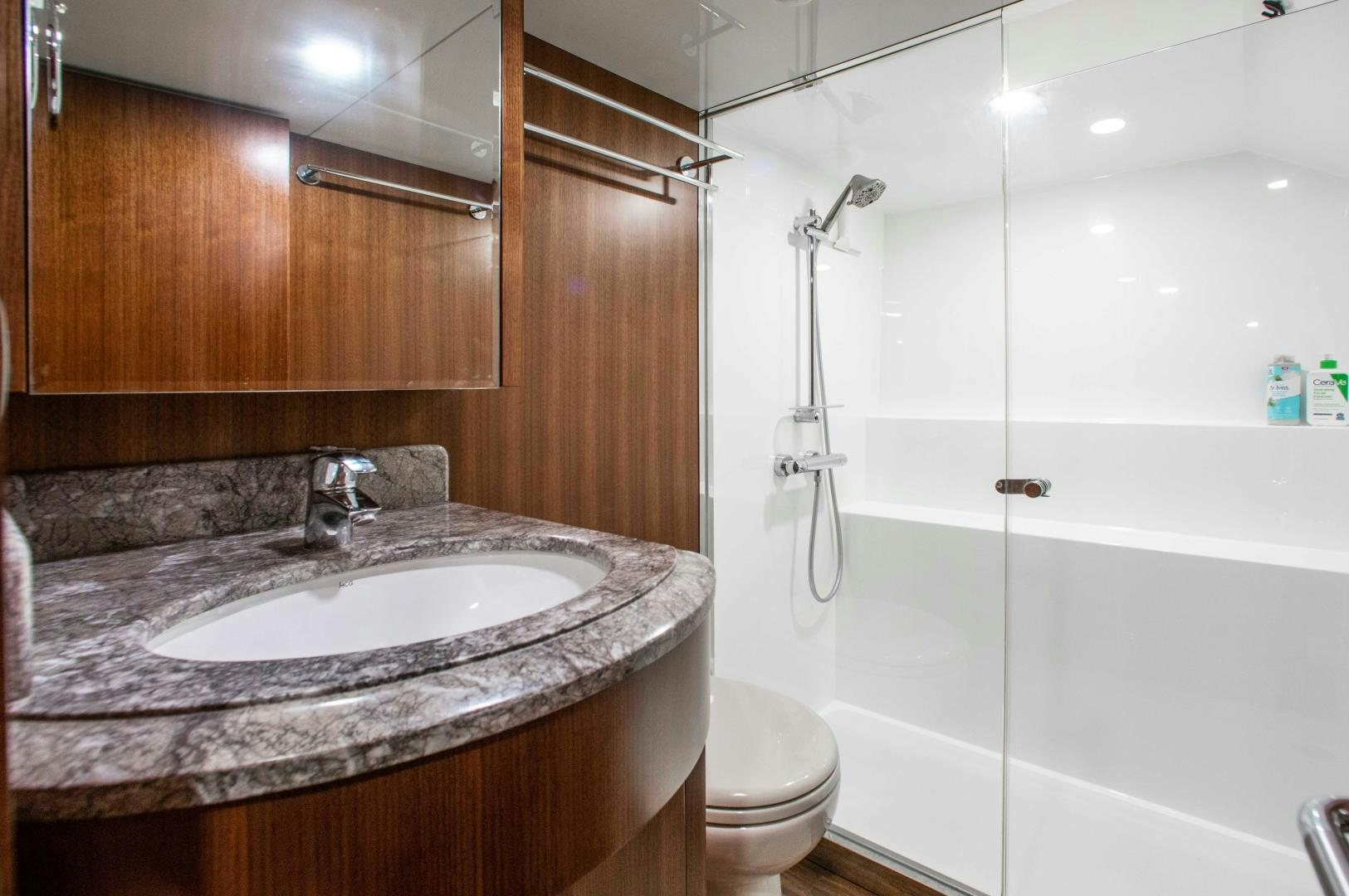 a bathroom with a sink and a toilet aboard TRINITY Yacht for Sale