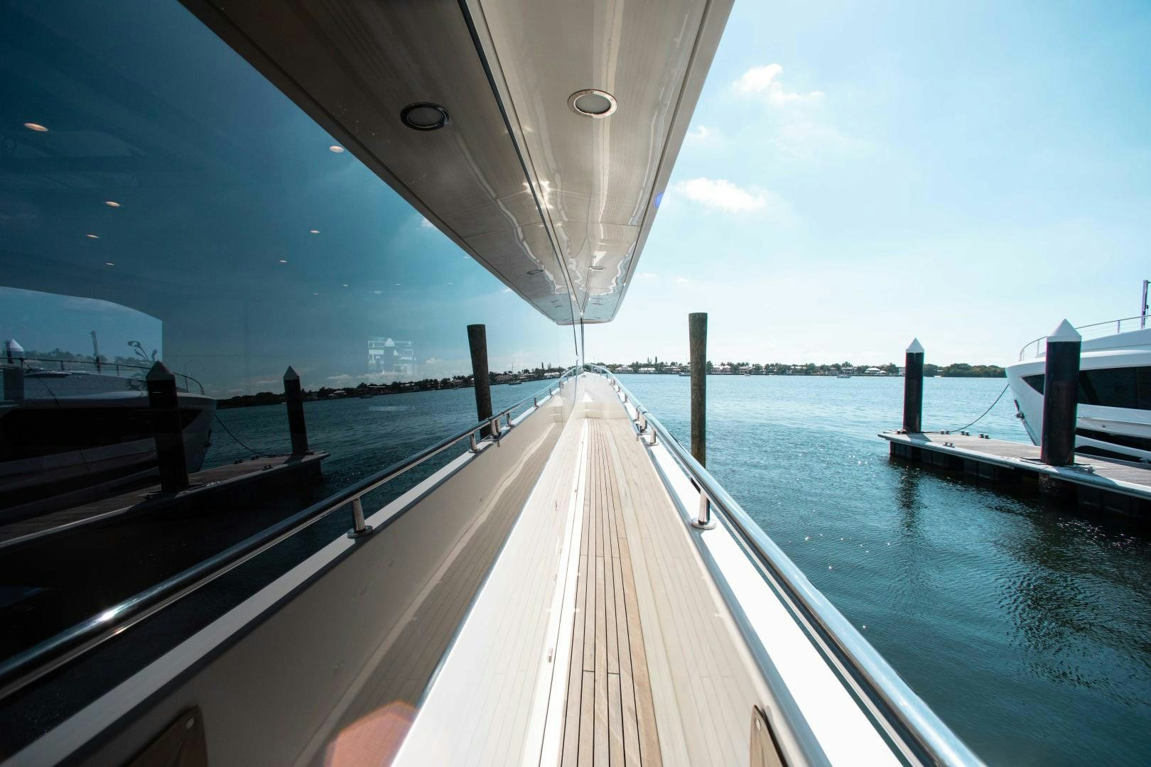 a wooden dock over water aboard TRINITY Yacht for Sale
