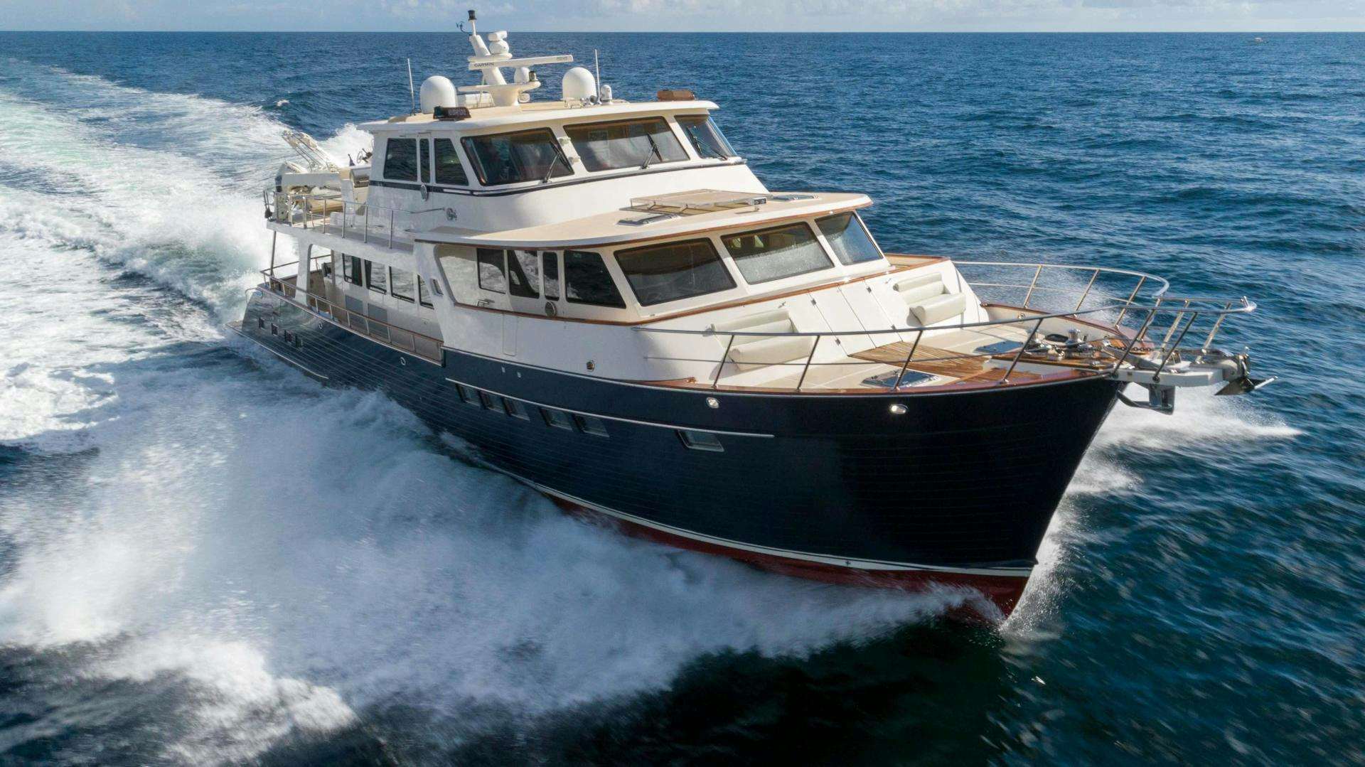 a large boat in the water aboard NEVER MY LOVE Yacht for Sale