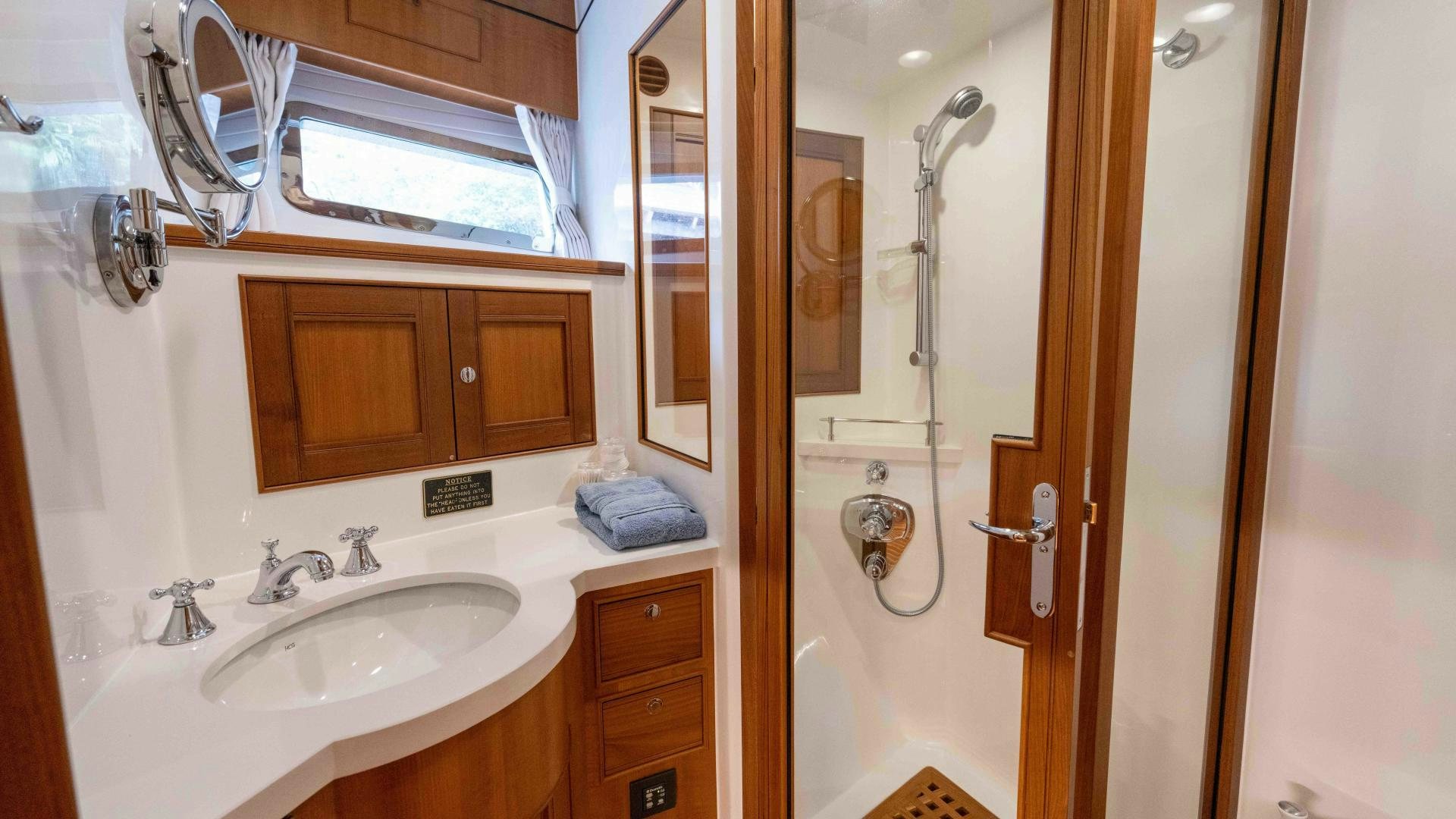 a bathroom with a sink and a shower aboard NEVER MY LOVE Yacht for Sale