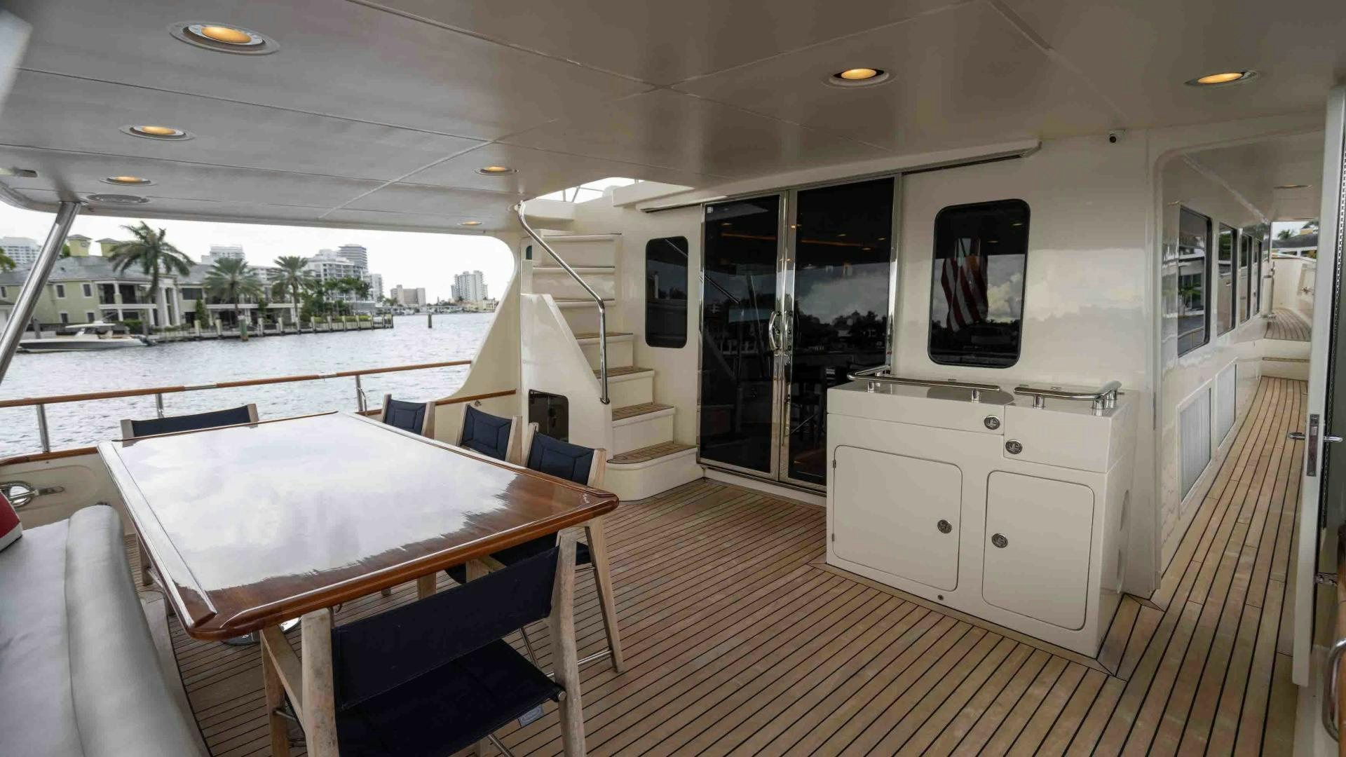 a room with a table and chairs aboard NEVER MY LOVE Yacht for Sale