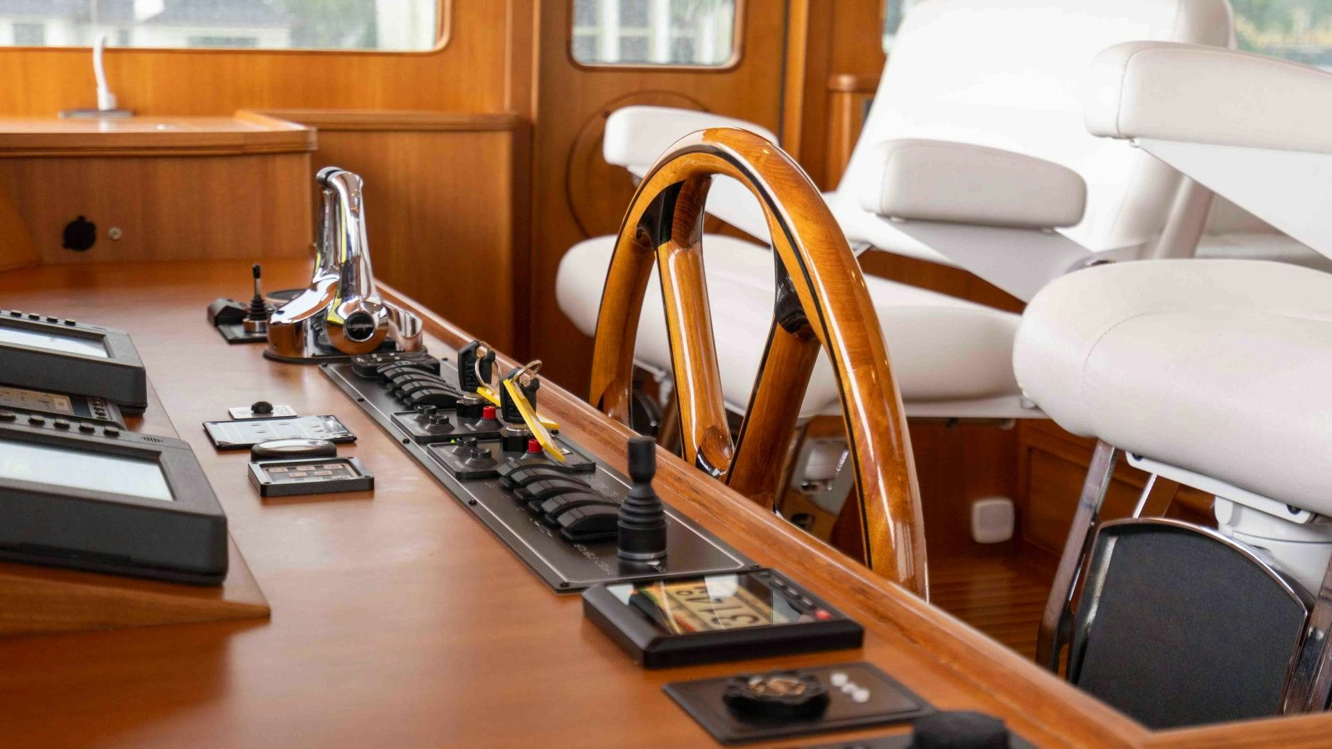 a desk with a computer and other office equipment aboard NEVER MY LOVE Yacht for Sale