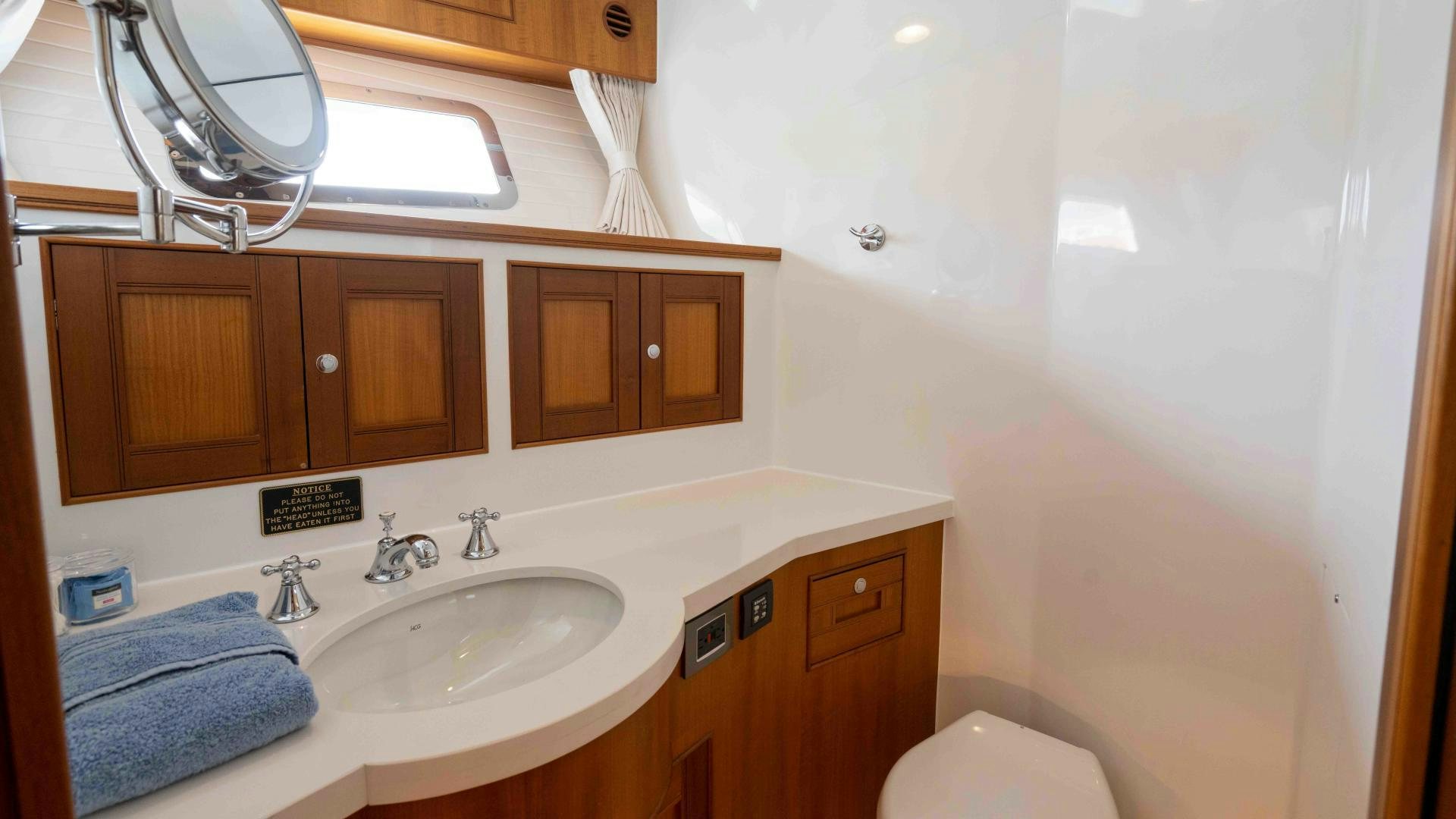 a bathroom with a sink and a mirror aboard NEVER MY LOVE Yacht for Sale