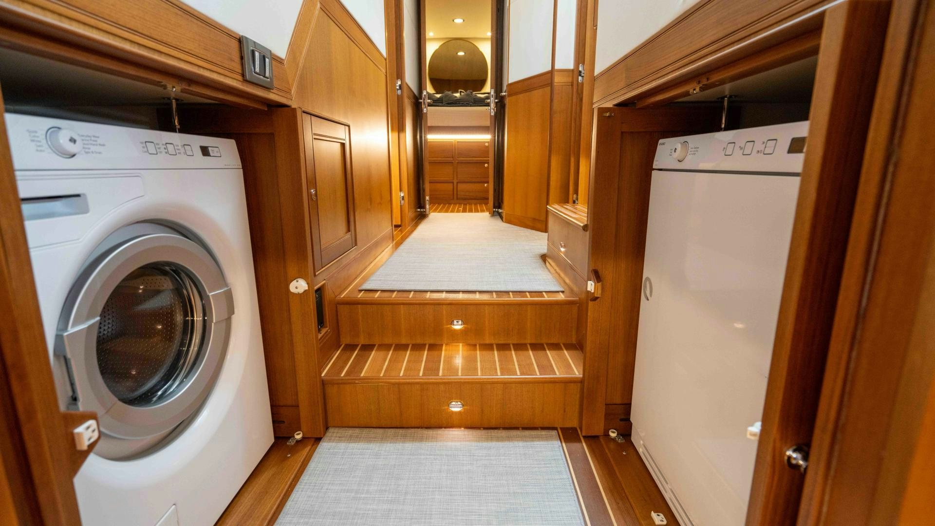 a room with a washing machine and a mirror aboard NEVER MY LOVE Yacht for Sale