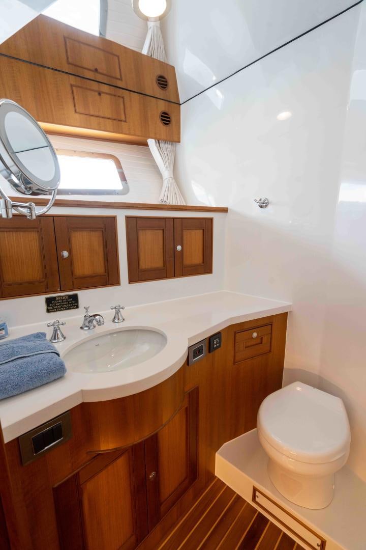 a bathroom with a sink and a toilet aboard NEVER MY LOVE Yacht for Sale
