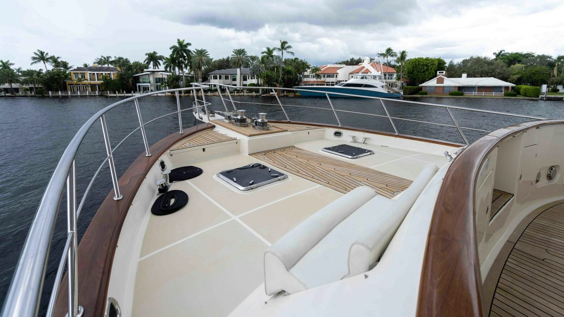 a white boat with a black roof aboard NEVER MY LOVE Yacht for Sale