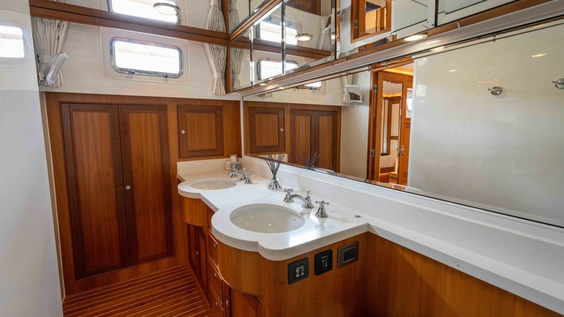 a bathroom with a sink and a mirror aboard NEVER MY LOVE Yacht for Sale