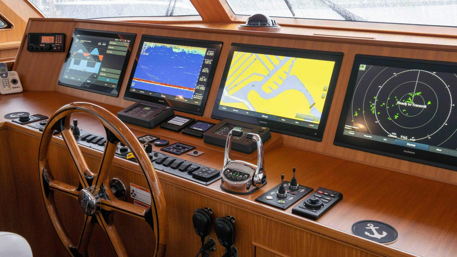 a control panel with multiple monitors aboard NEVER MY LOVE Yacht for Sale