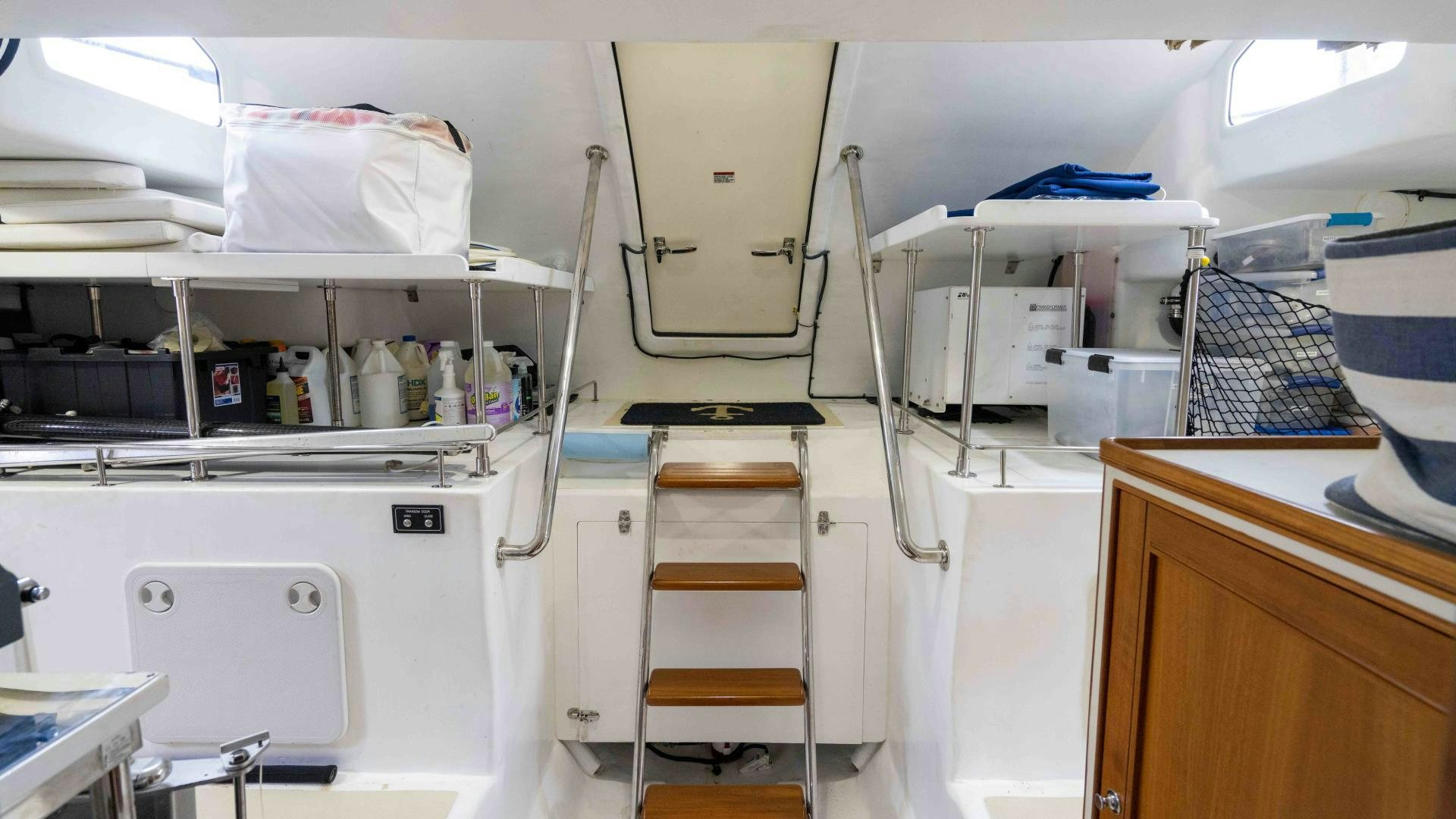 a room with white cabinets and a ladder aboard NEVER MY LOVE Yacht for Sale