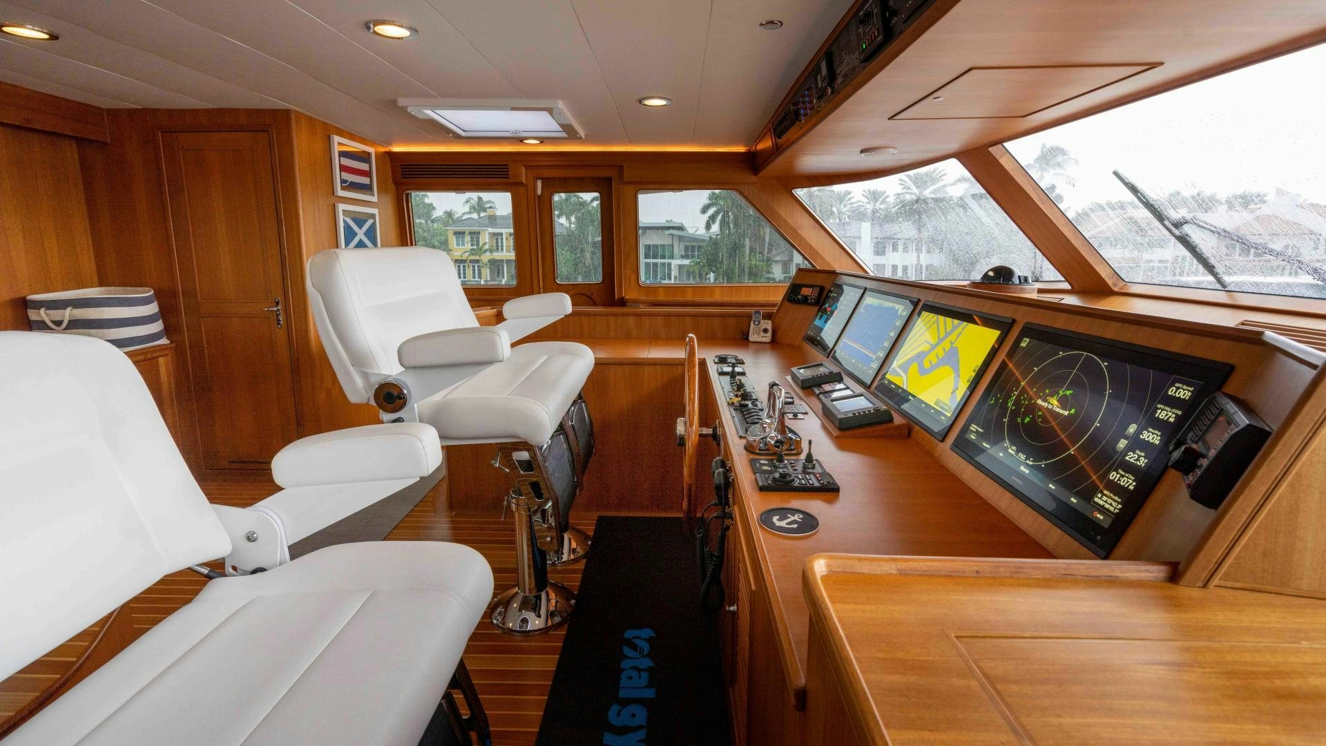 a room with a desk and chairs aboard NEVER MY LOVE Yacht for Sale