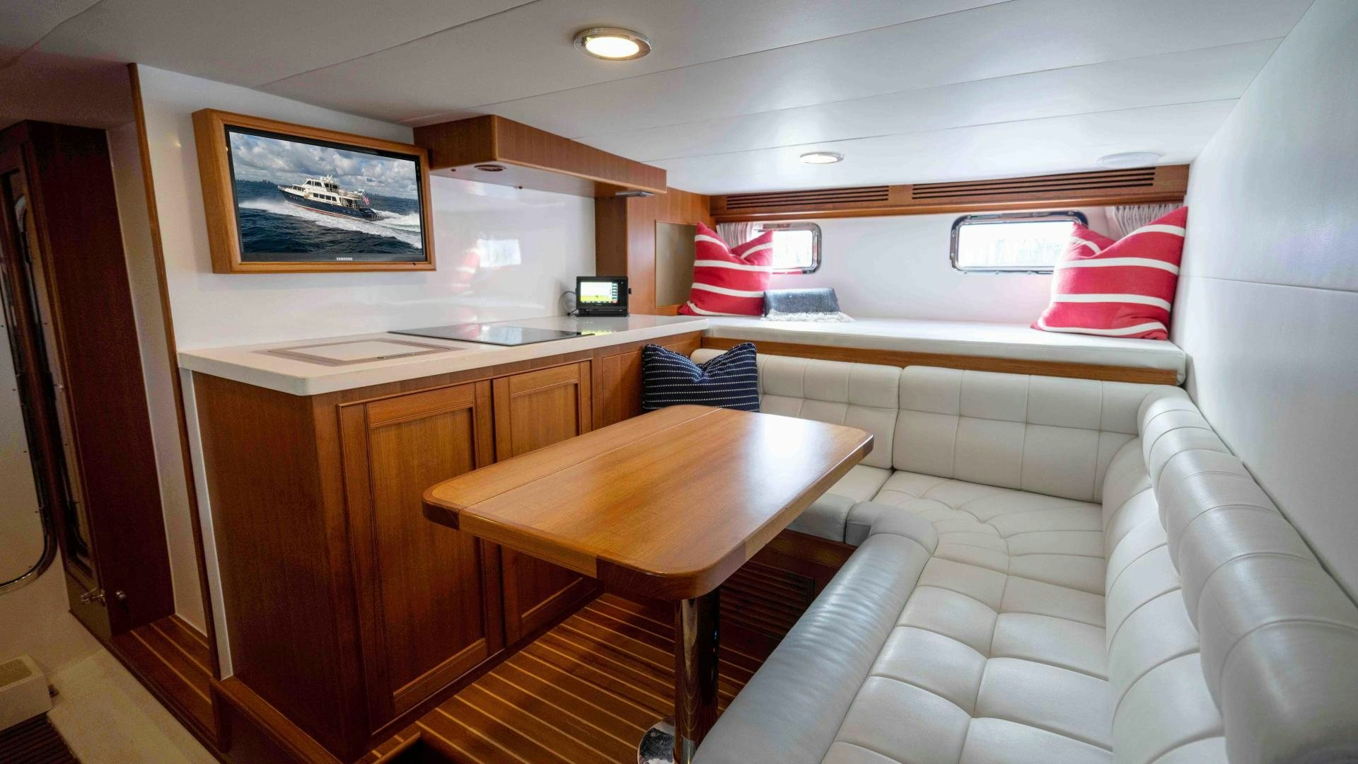a room with a table and chairs aboard NEVER MY LOVE Yacht for Sale