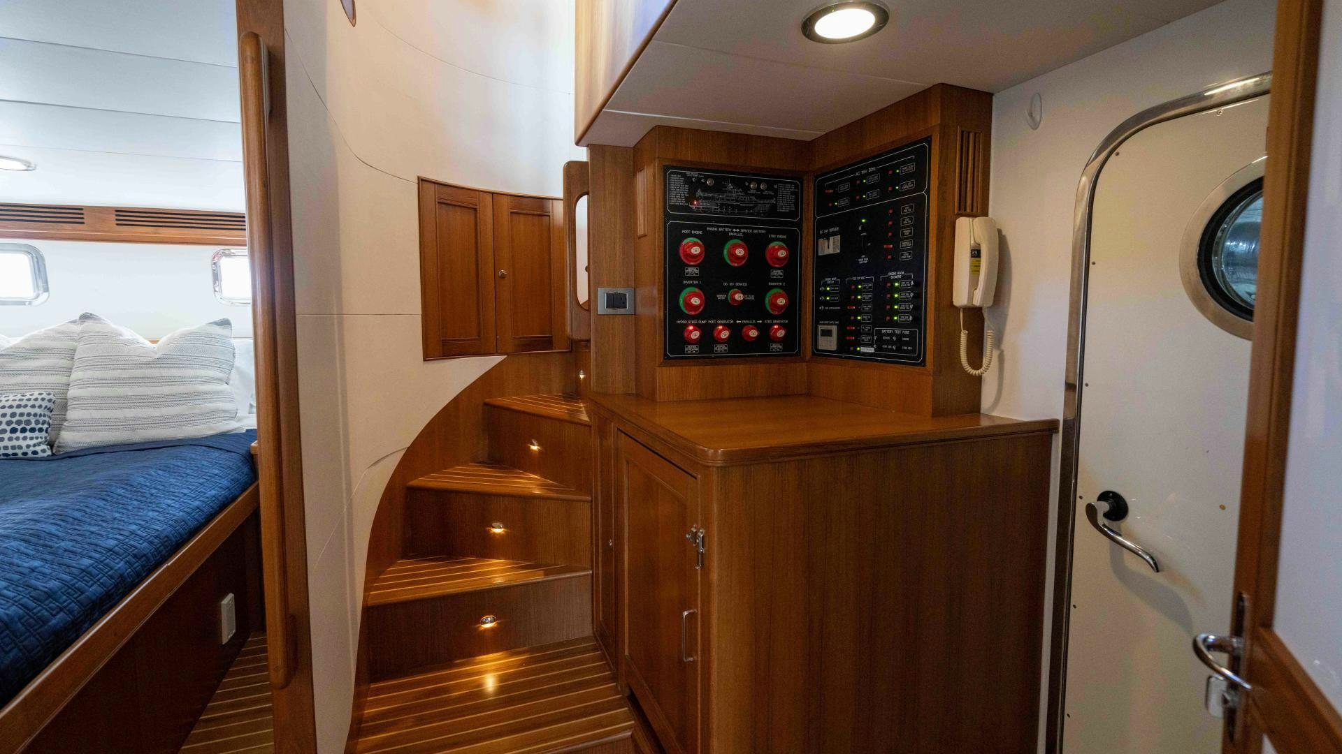 a bedroom with a bed and a desk aboard NEVER MY LOVE Yacht for Sale