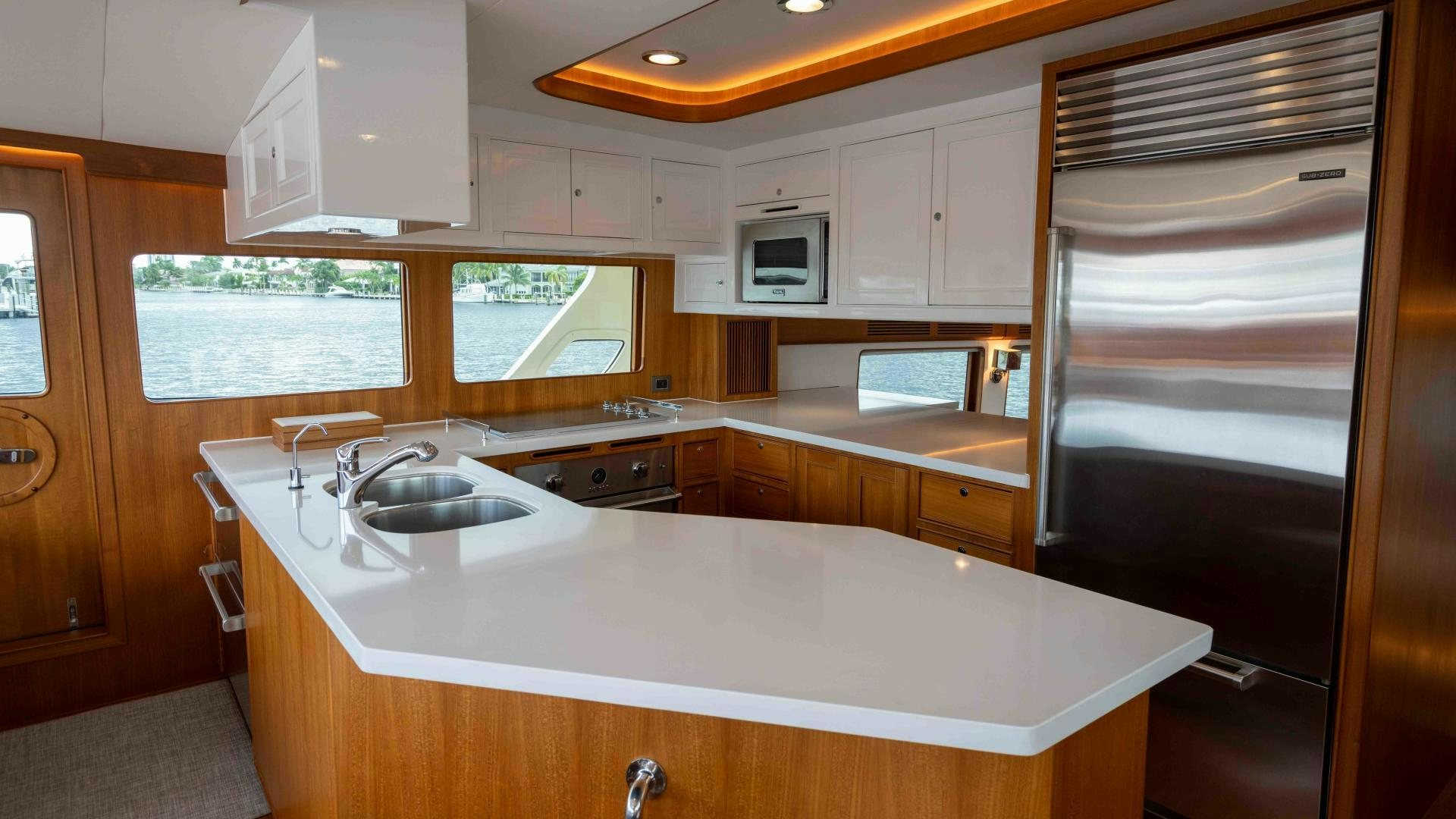 a kitchen with a sink and microwave aboard NEVER MY LOVE Yacht for Sale