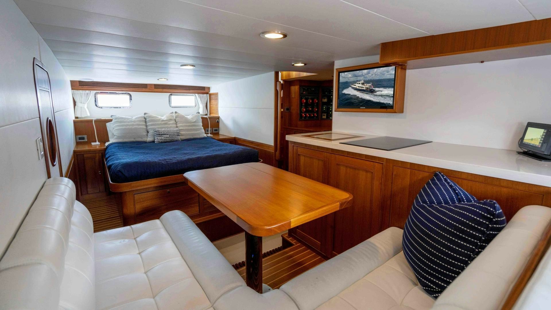 a living room with a couch and a table aboard NEVER MY LOVE Yacht for Sale