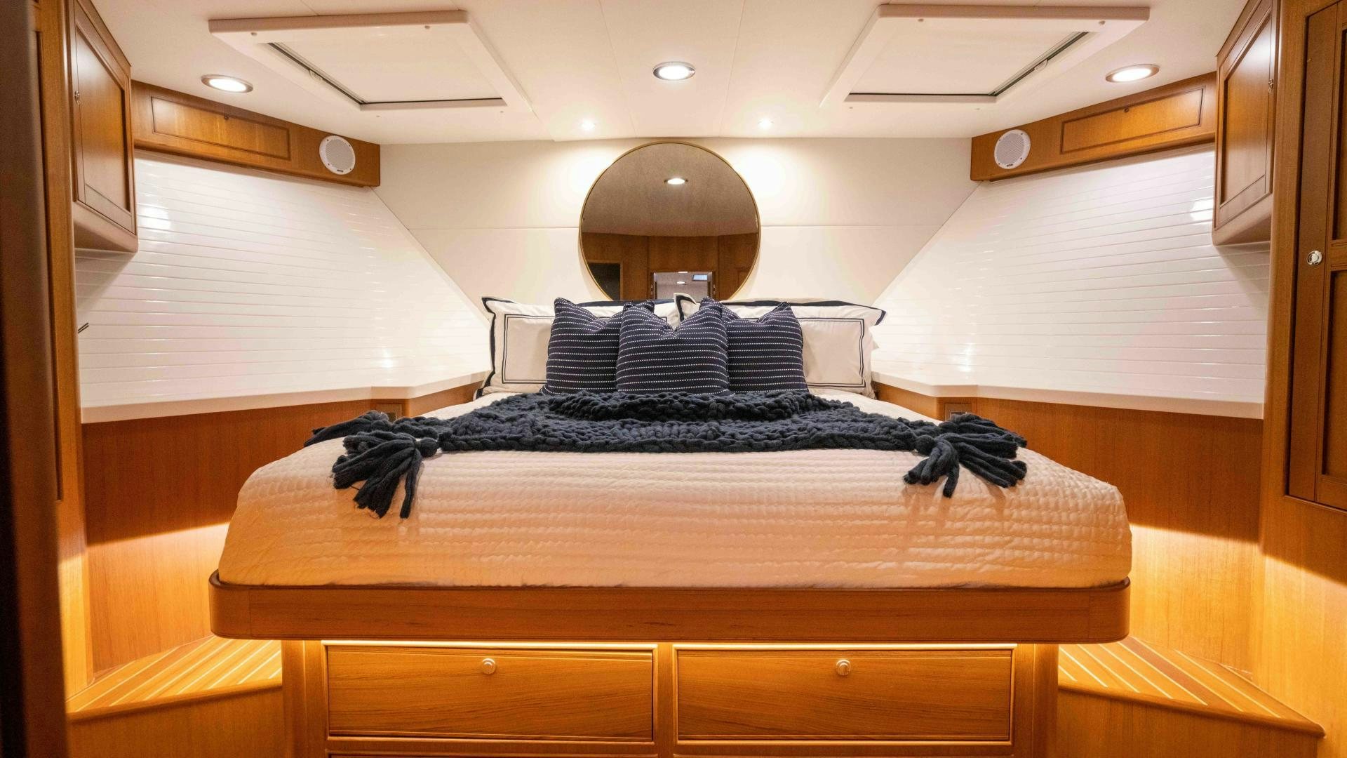 a bed with a black blanket aboard NEVER MY LOVE Yacht for Sale