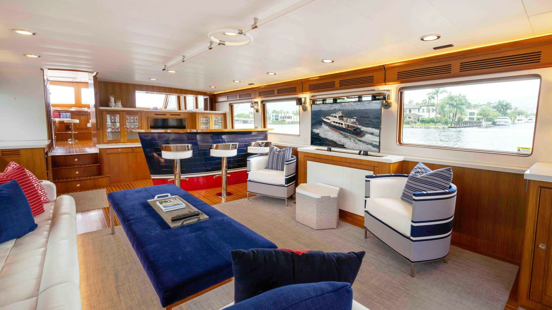 a living room with a large screen aboard NEVER MY LOVE Yacht for Sale