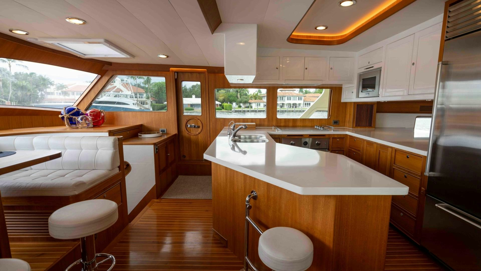 a kitchen with a large island aboard NEVER MY LOVE Yacht for Sale