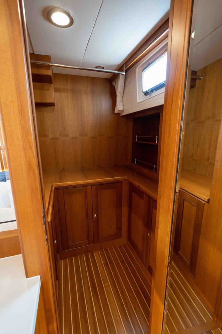 a kitchen with wooden cabinets aboard NEVER MY LOVE Yacht for Sale