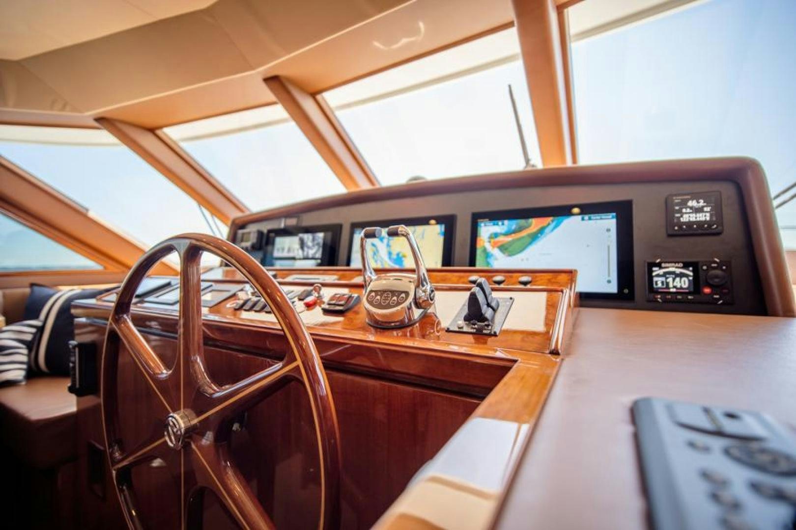 a wooden table with a chair and a computer on it aboard LODESTAR Yacht for Sale