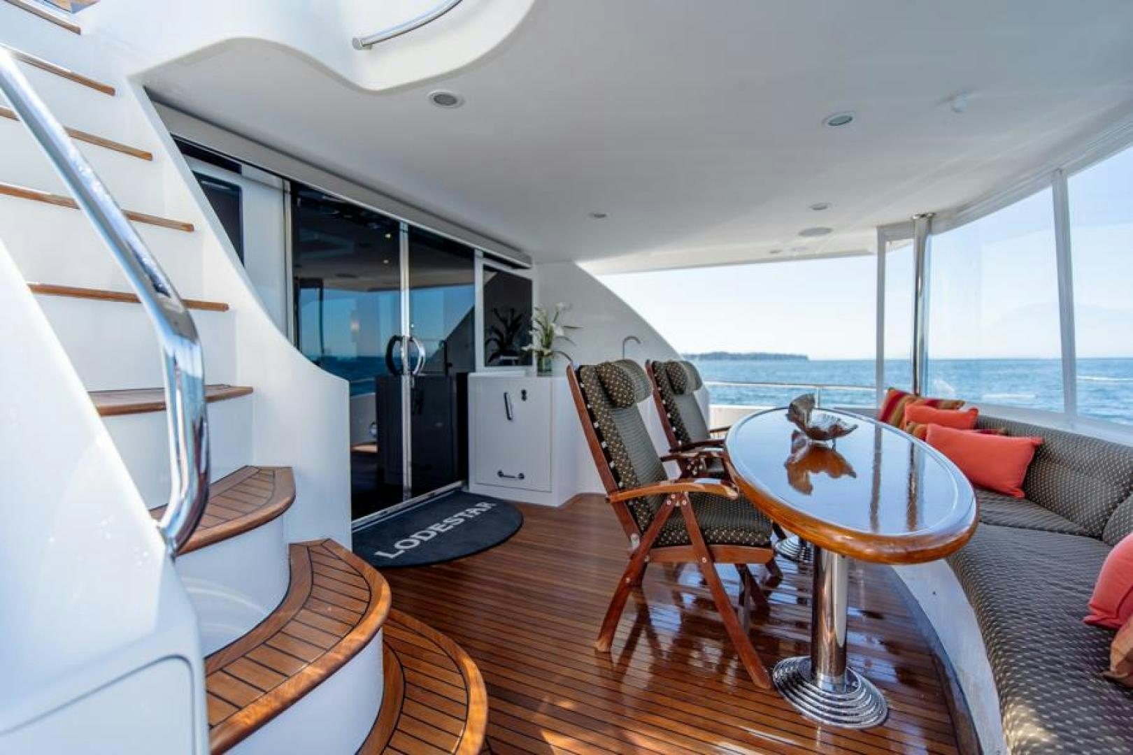 a living room with a table and chairs aboard LODESTAR Yacht for Sale