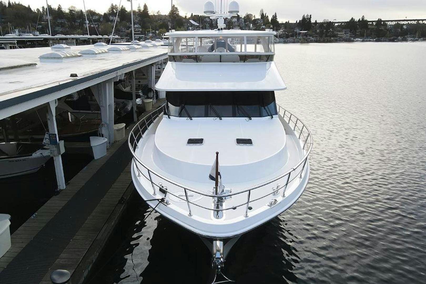 a boat docked at a pier aboard LODESTAR Yacht for Sale