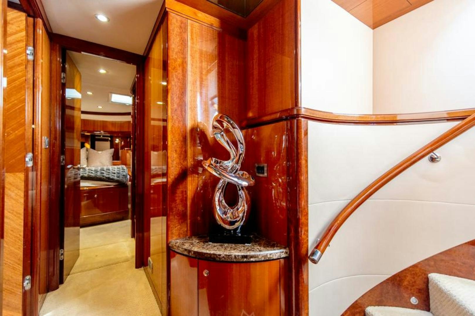 a room with a wood door and a mirror aboard LODESTAR Yacht for Sale