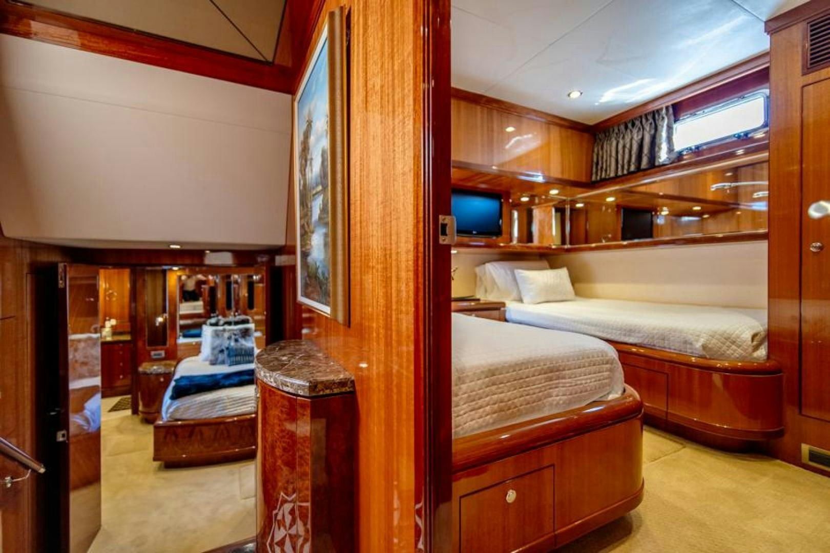 a room with a bed and a desk aboard LODESTAR Yacht for Sale