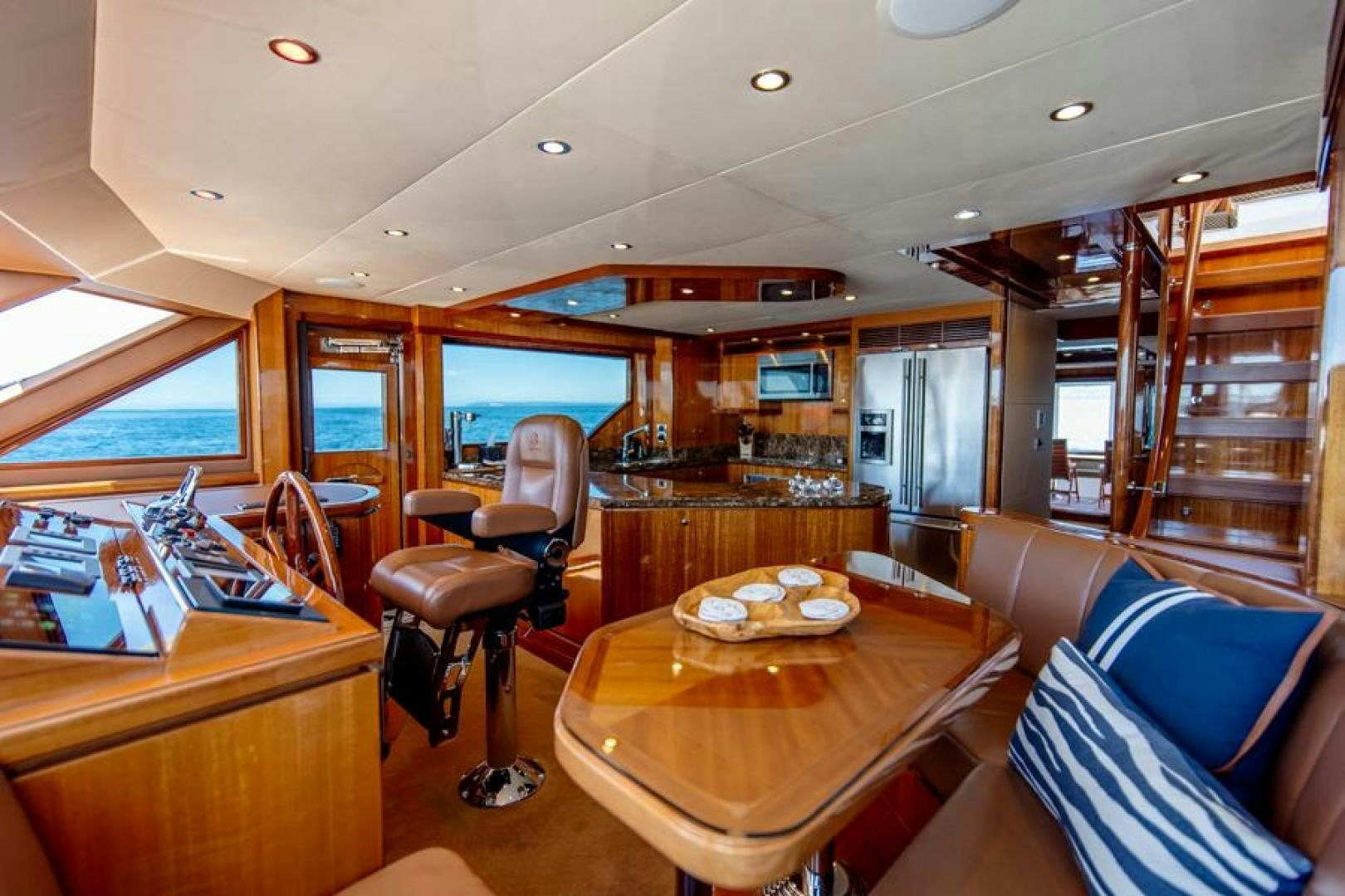 a room with a table chairs and a window aboard LODESTAR Yacht for Sale