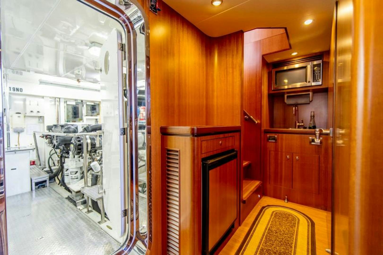 a kitchen with a glass door aboard LODESTAR Yacht for Sale