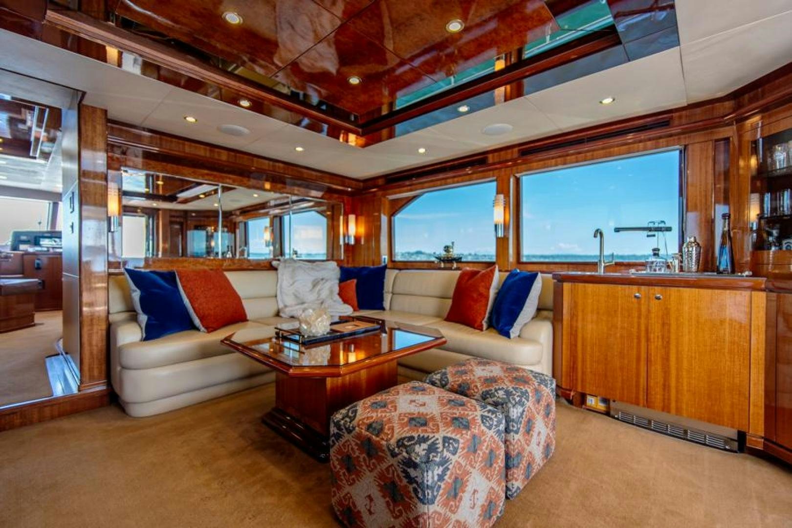 a living room with a couch and a table aboard LODESTAR Yacht for Sale