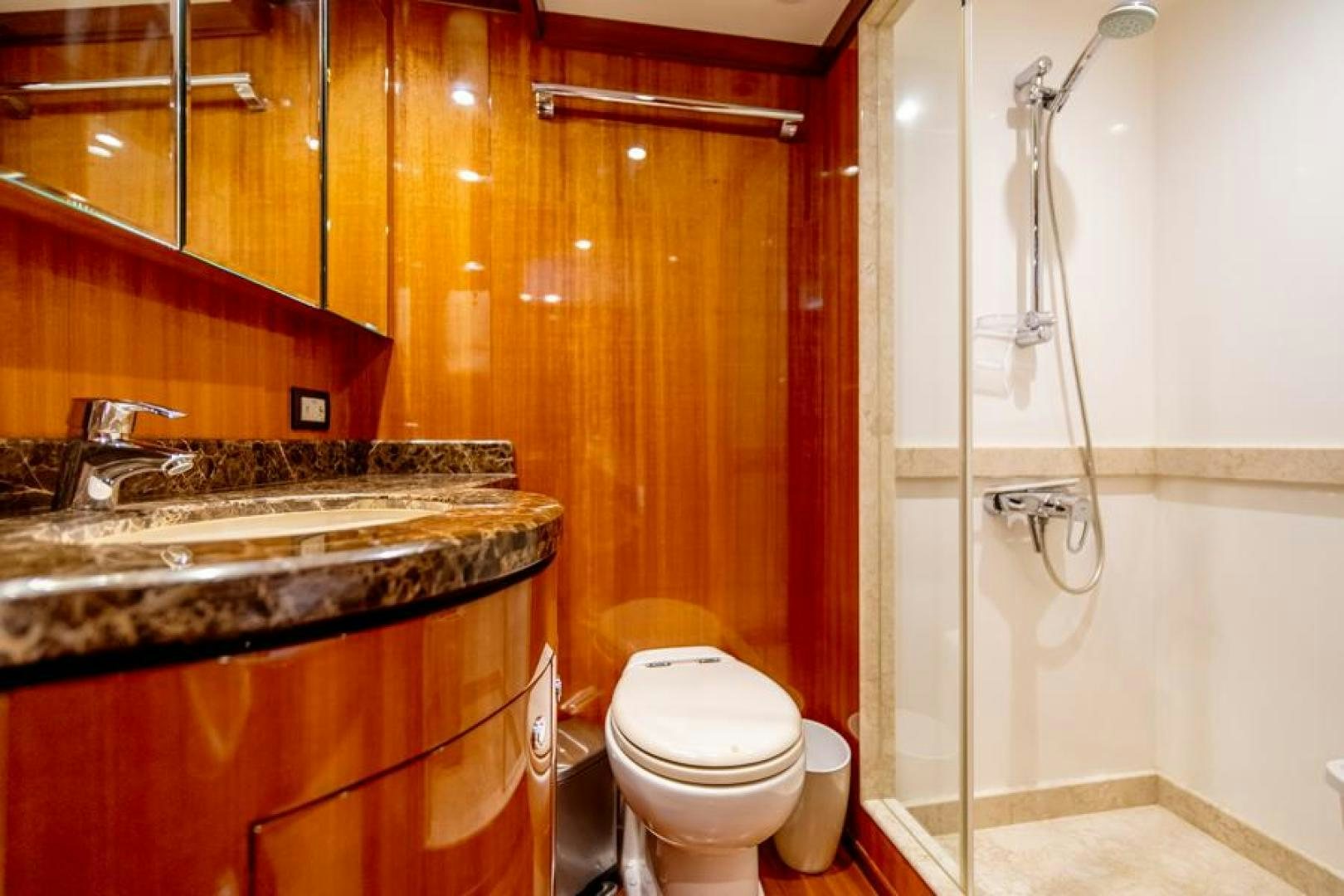 a bathroom with a sink toilet and shower aboard LODESTAR Yacht for Sale