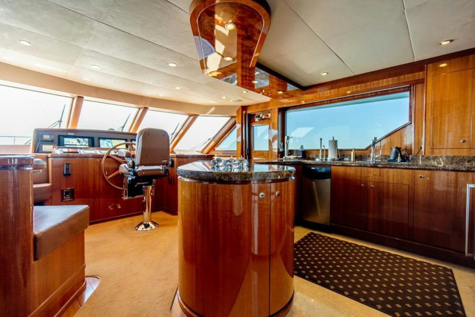 a bar with a bar and a bar in the background aboard LODESTAR Yacht for Sale