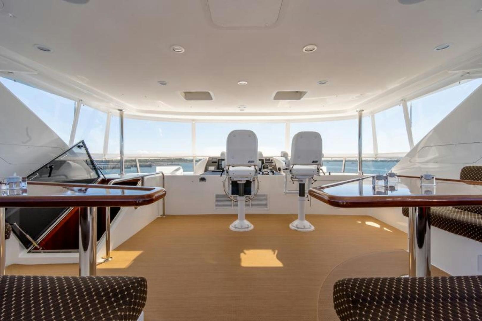 a room with a table and chairs aboard LODESTAR Yacht for Sale