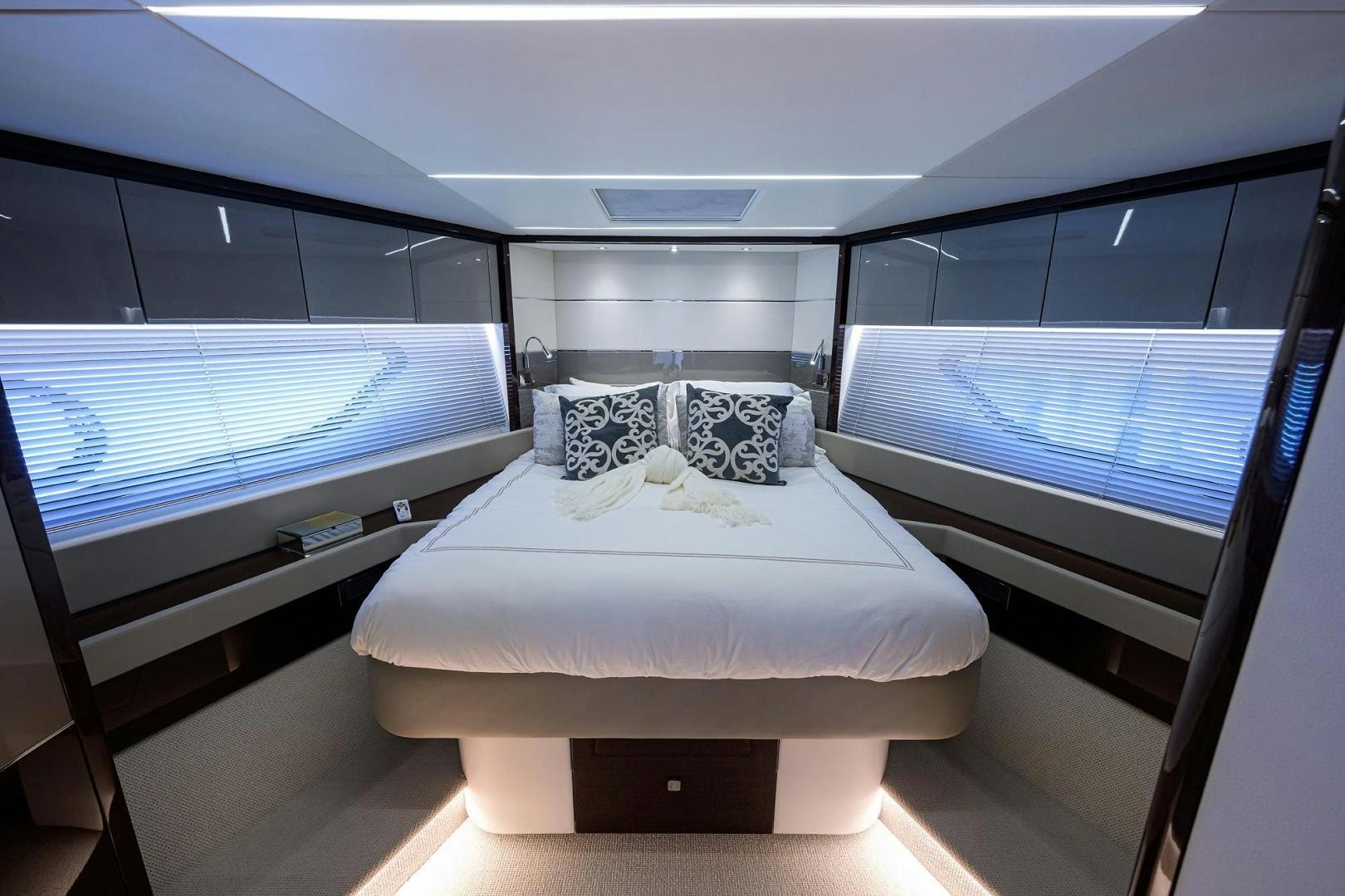 a room with a bed and a window aboard NIGHT STAR Yacht for Sale