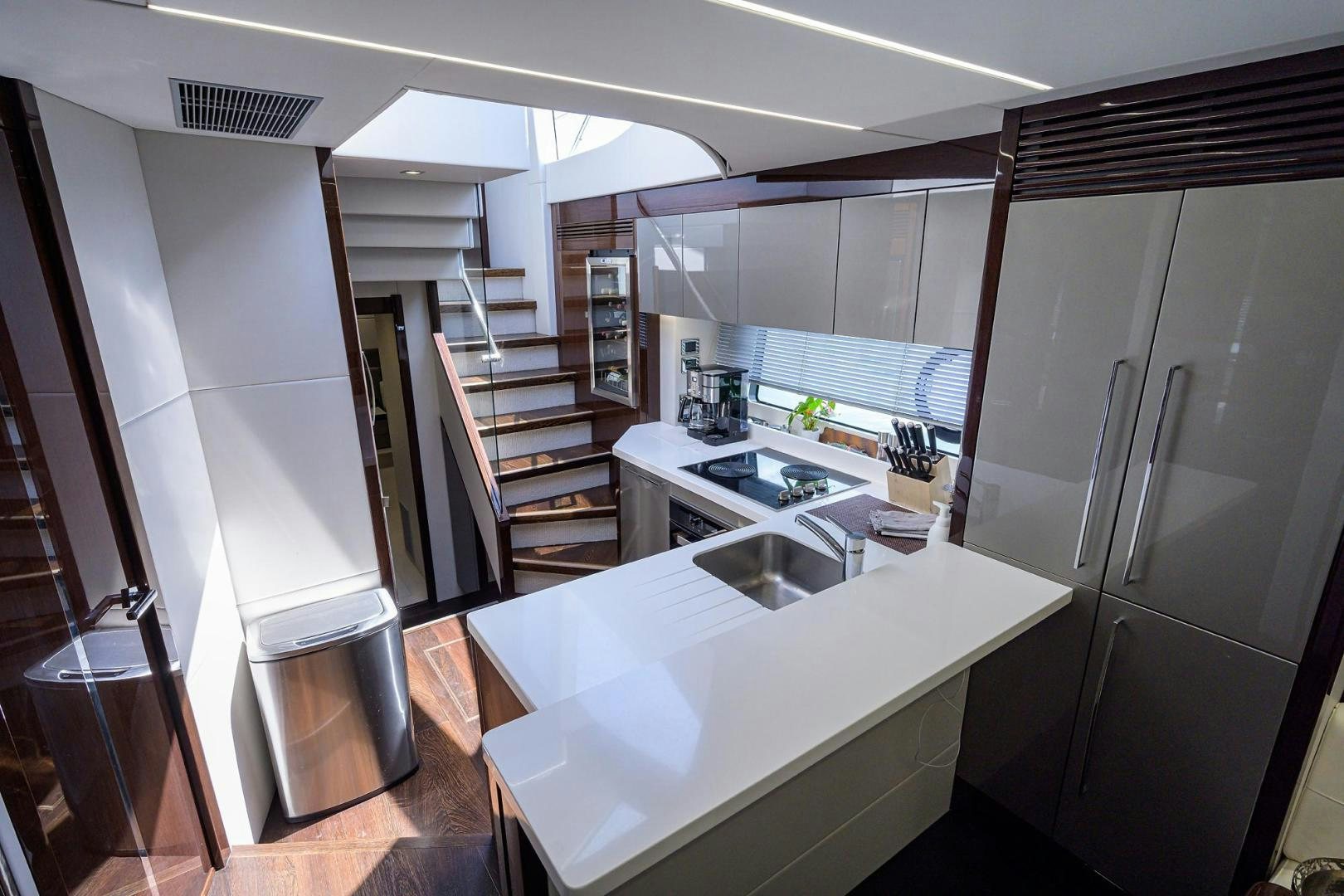 a kitchen with a large island aboard NIGHT STAR Yacht for Sale