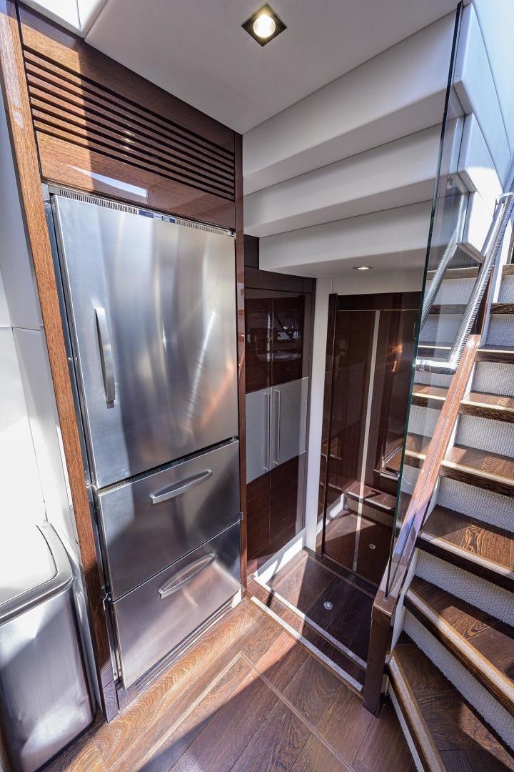 a large metal refrigerator in a kitchen aboard NIGHT STAR Yacht for Sale