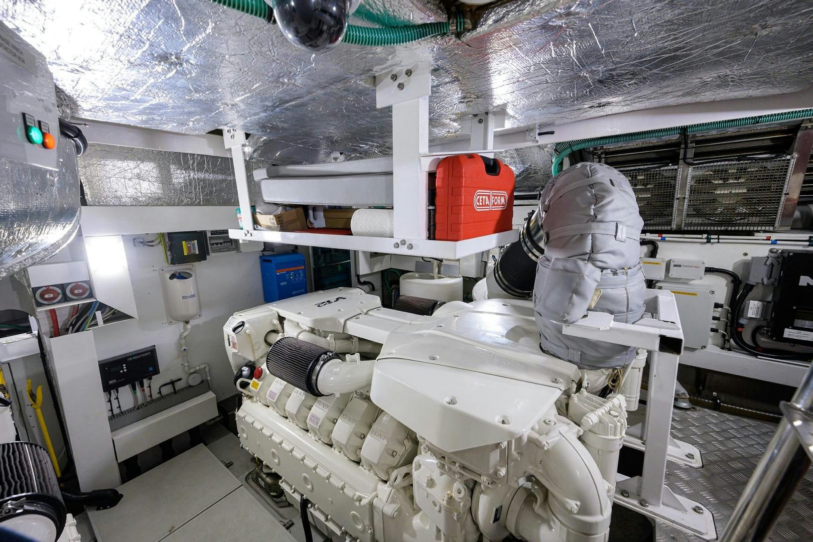 a room with a few white helmets and a red box aboard NIGHT STAR Yacht for Sale