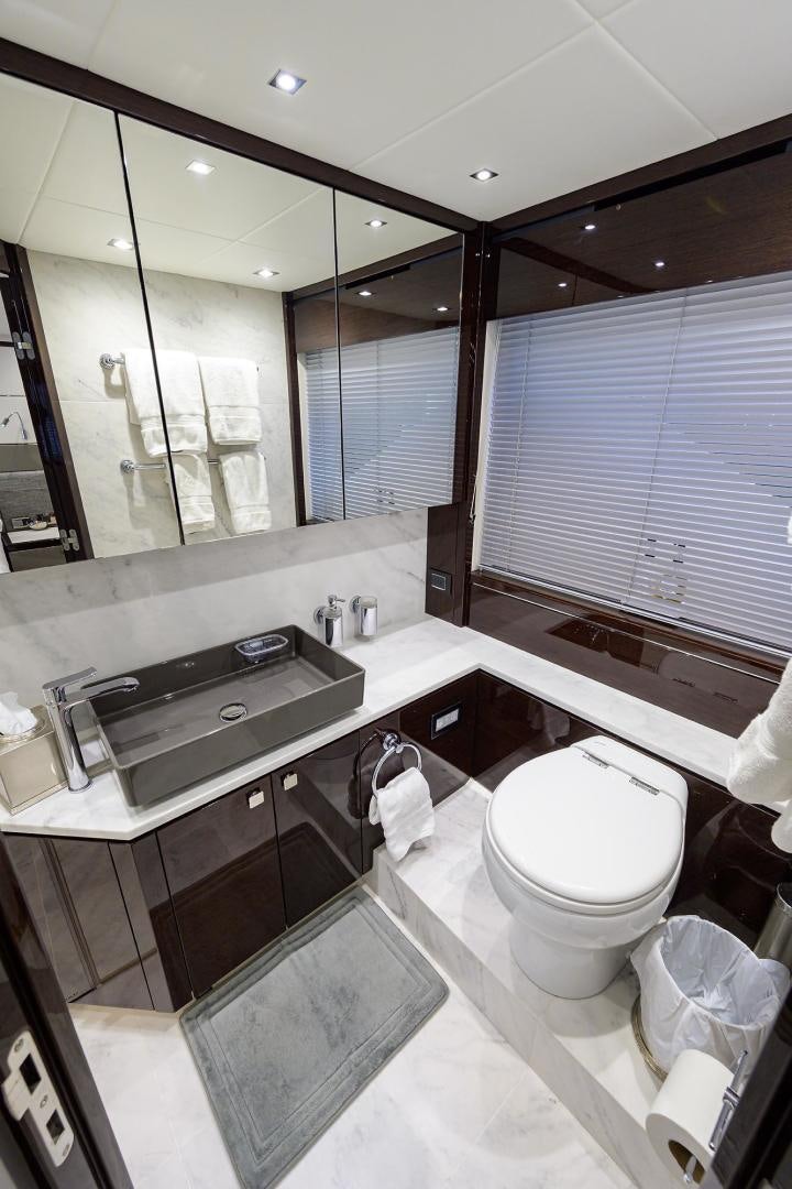 a bathroom with a large mirror aboard NIGHT STAR Yacht for Sale