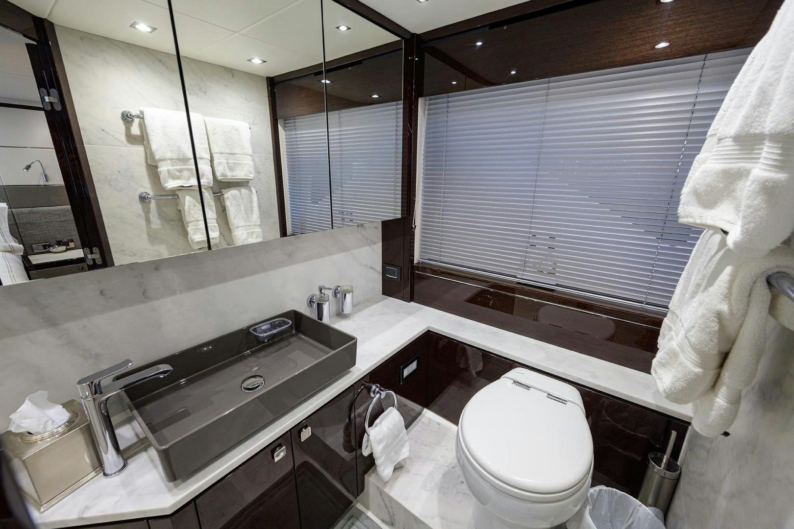 a bathroom with a sink and a toilet aboard NIGHT STAR Yacht for Sale