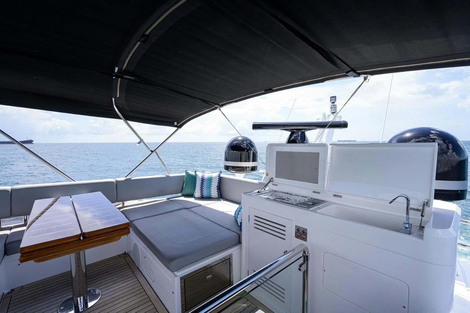 a boat with a desk and laptops on it aboard NIGHT STAR Yacht for Sale