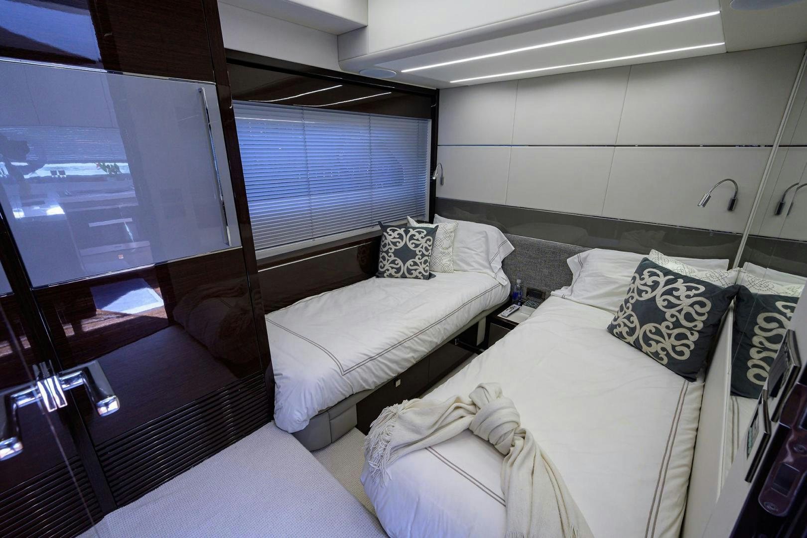 a room with a bed and a window aboard NIGHT STAR Yacht for Sale