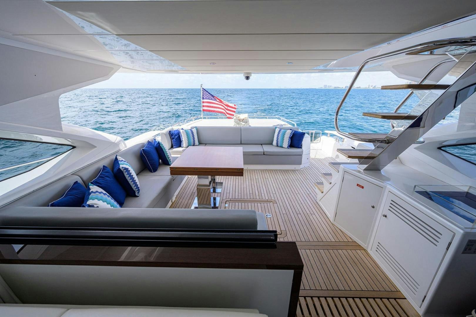 a boat with a flag on the deck aboard NIGHT STAR Yacht for Sale
