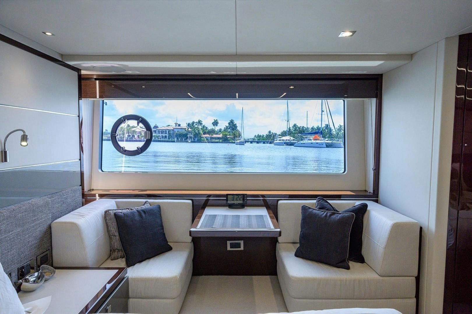 a room with a couch and a window aboard NIGHT STAR Yacht for Sale