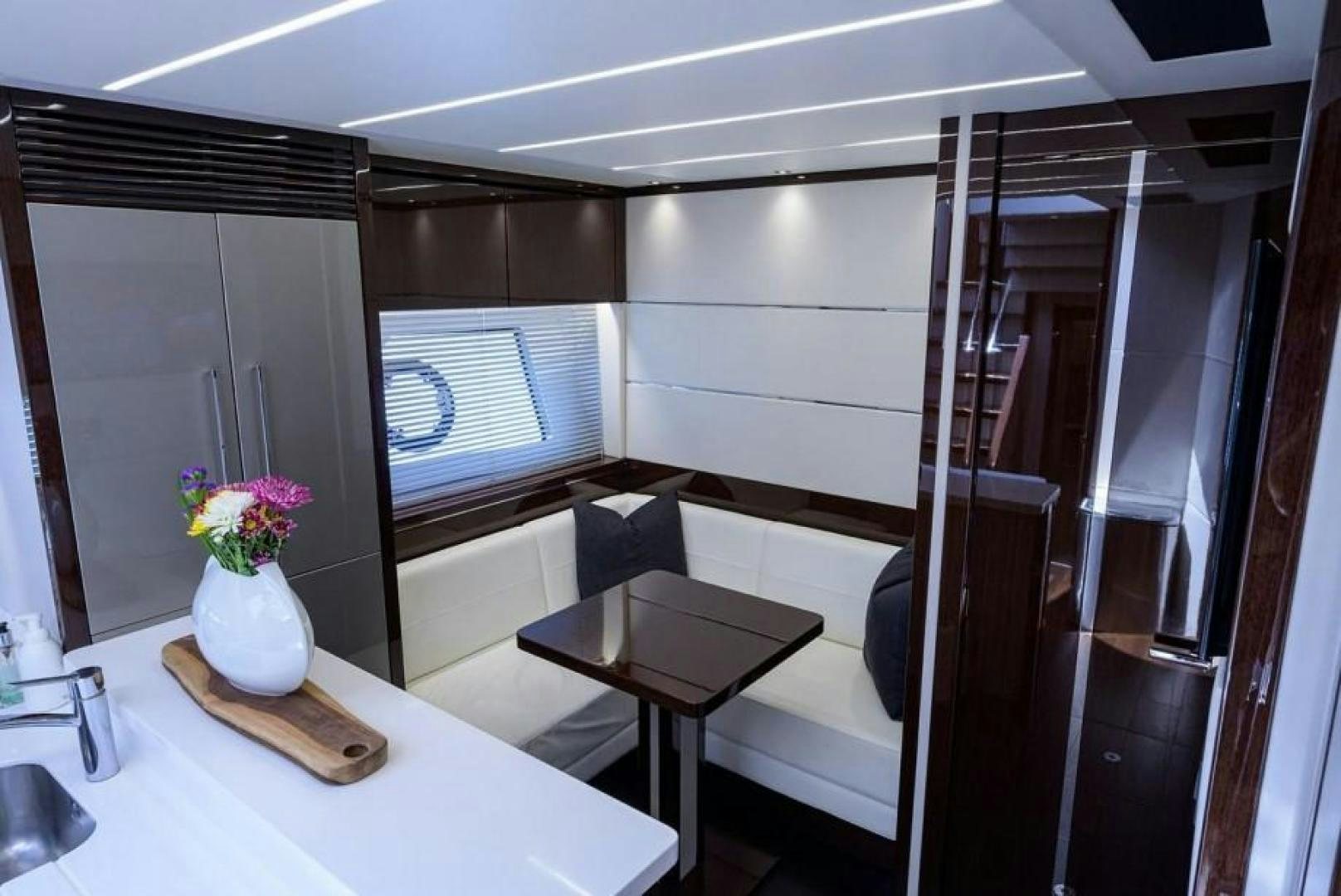 a room with a table and chairs aboard NIGHT STAR Yacht for Sale