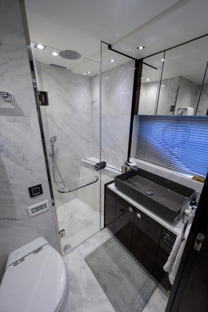 a bathroom with a glass shower aboard NIGHT STAR Yacht for Sale