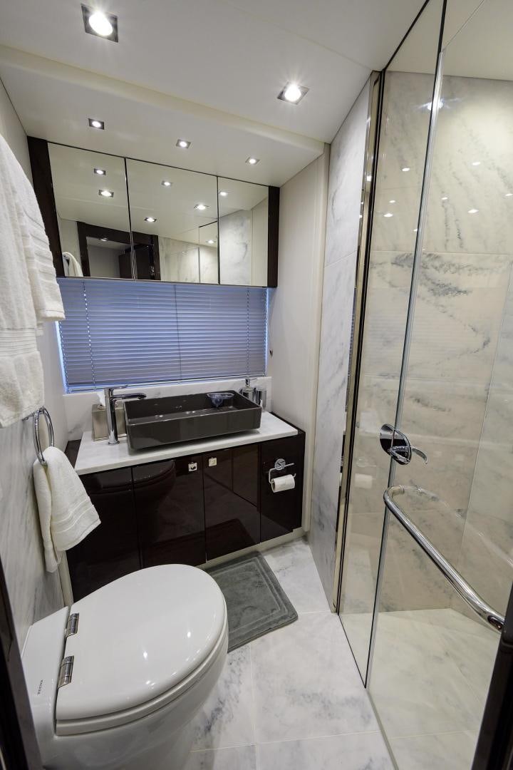 a bathroom with a shower unit and sink aboard NIGHT STAR Yacht for Sale