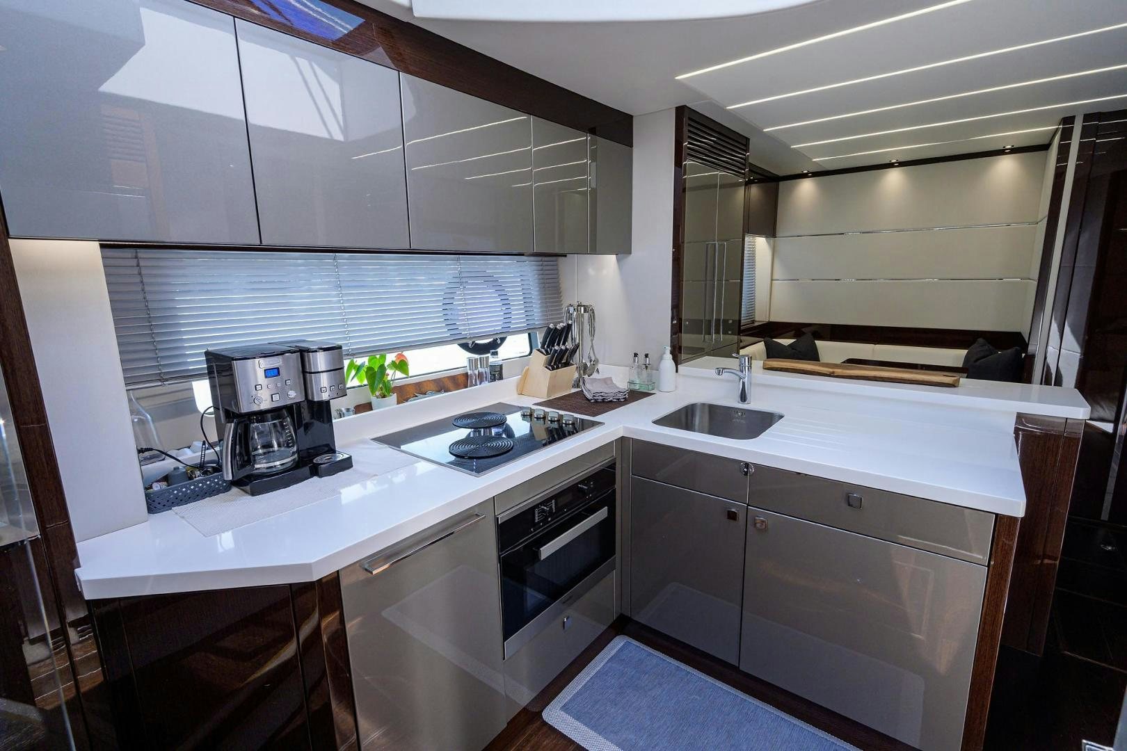 a kitchen with white cabinets aboard NIGHT STAR Yacht for Sale