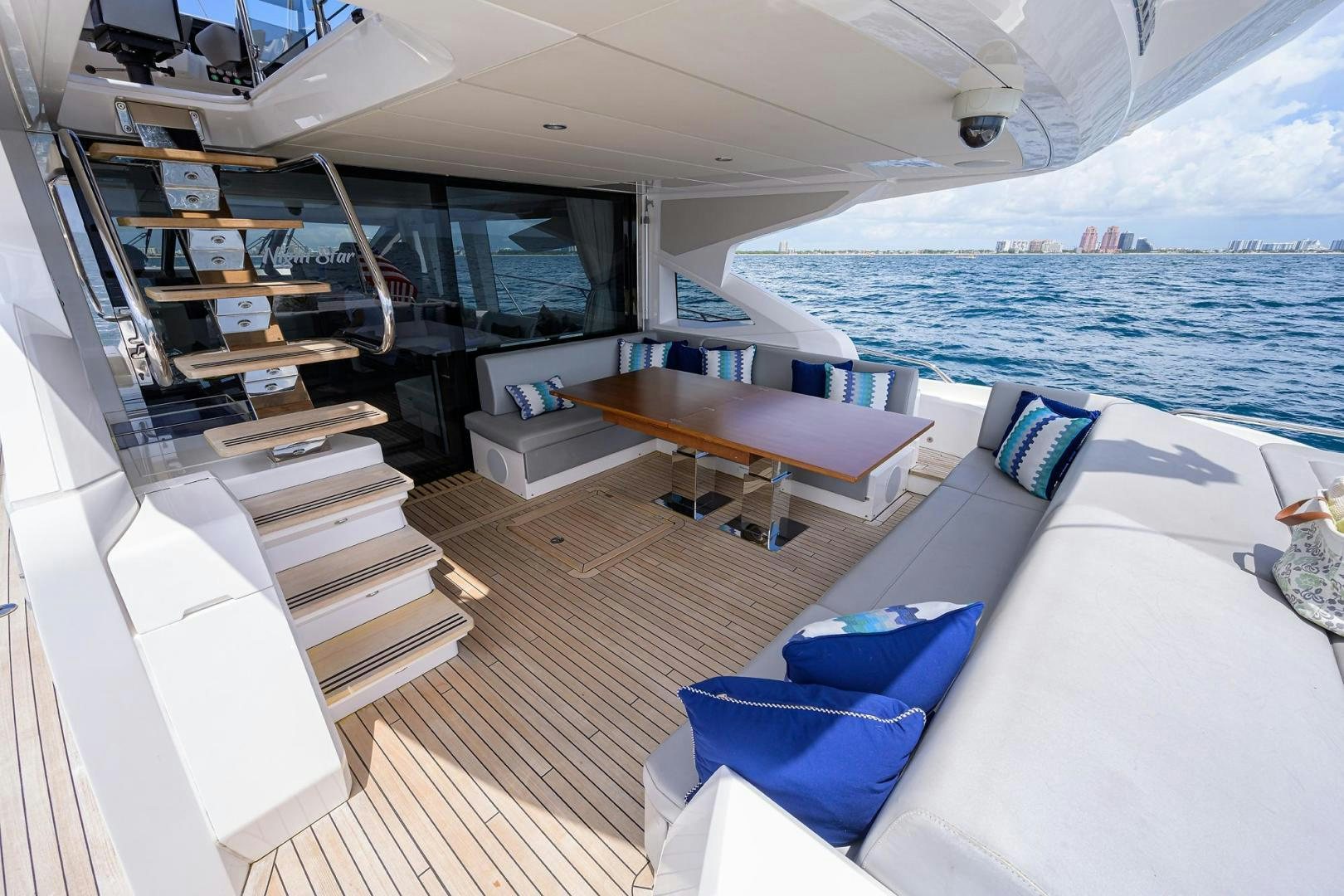 a boat with a bed and a table and chairs aboard NIGHT STAR Yacht for Sale